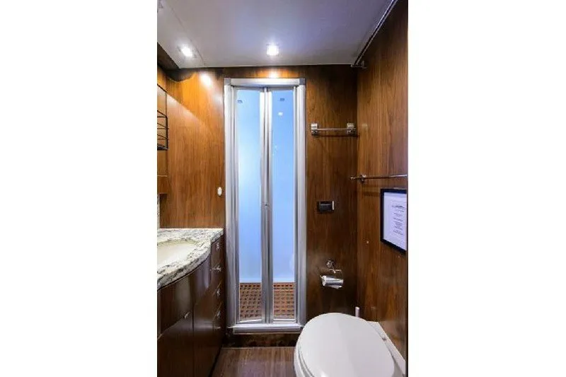 Slide: The Image of Luxurious bathroom in 2018 Hargrave Raised Pilothouse yacht with wood paneling and modern fixtures. - 63
