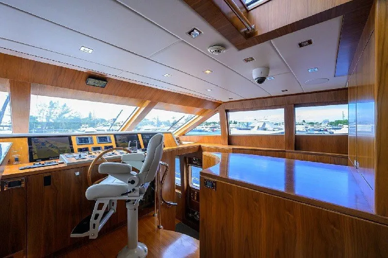 Slide: The Image of Luxurious 2018 Hargrave Raised Pilothouse interior with wood finish and modern navigation equipment. - 28