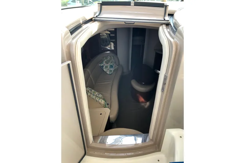 Slide: The Image of Interior view of 2004 Sea Ray 420 Sundancer cabin with seating and cushions. - 16
