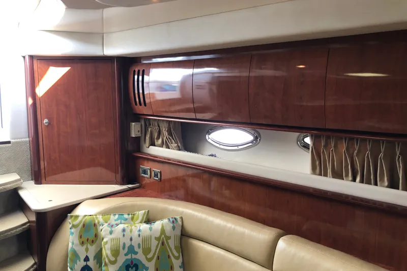Slide: The Image of Luxurious interior of 2004 Sea Ray 420 Sundancer yacht with wood cabinetry and plush seating. - 25