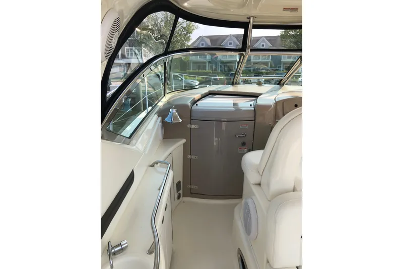 Slide: The Image of Interior of 2004 Sea Ray 420 Sundancer yacht, featuring helm and seating area. - 15