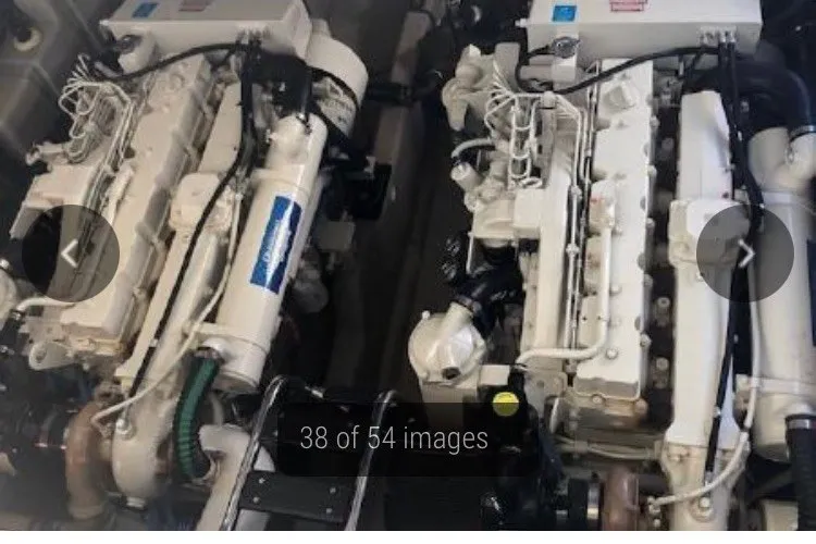 Slide: The Image of Twin engines of a 2004 Sea Ray 420 Sundancer yacht in the engine room. - 29