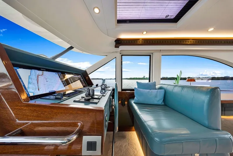 Slide: The Image of Luxurious interior of 2021 Steeler 60S yacht with navigation system and plush seating. - 79