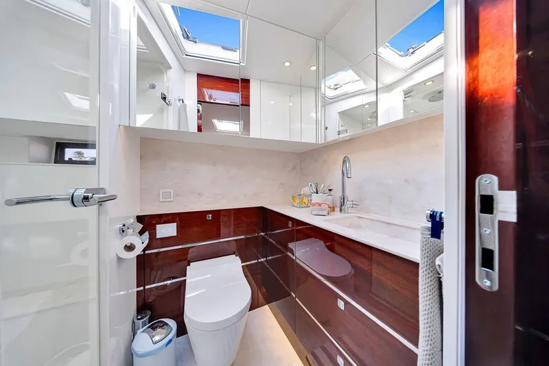 Slide: The Image of Luxurious bathroom interior on 2021 Steeler 60S yacht, featuring modern fixtures and skylight. - 109