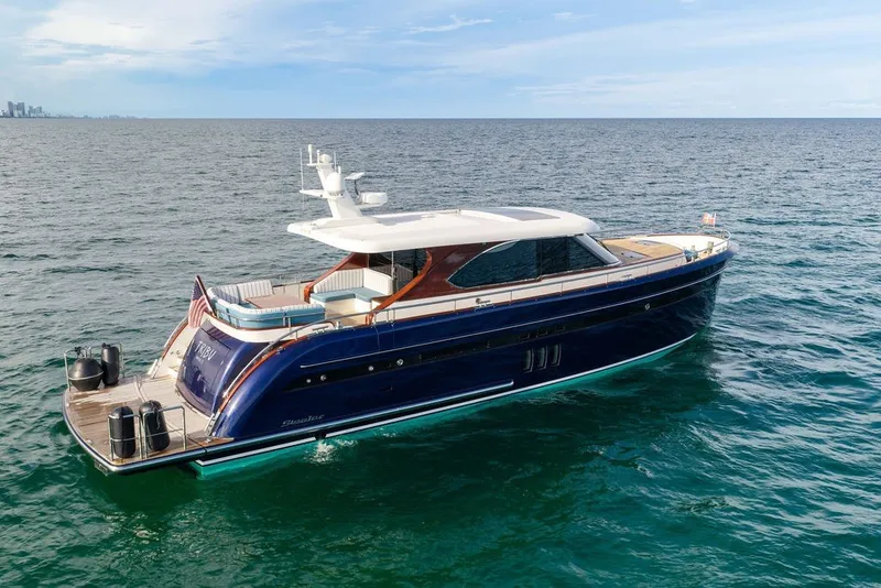 Slide: The Image of Luxurious 2021 Steeler 60S yacht cruising on open sea under clear skies. - 4
