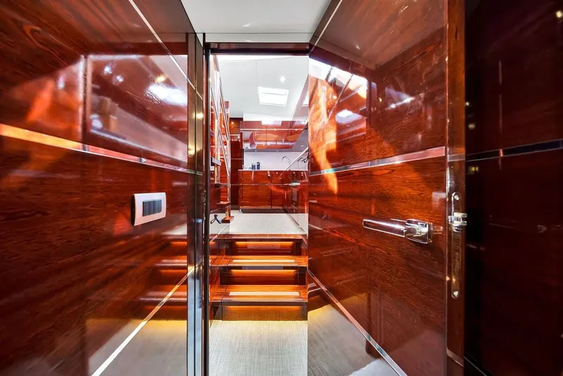 Slide: The Image of Luxurious interior of 2021 Steeler 60S yacht with polished wood finish and modern design. - 101