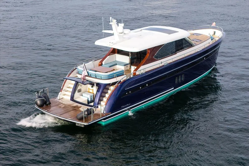 Slide: The Image of Luxury 2021 Steeler 60S yacht cruising on open water, showcasing sleek design and elegance. - 46