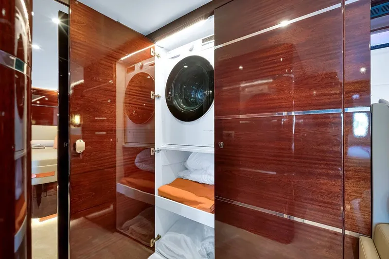 Slide: The Image of Luxurious interior of 2021 Steeler 60S yacht with built-in laundry facilities. - 92