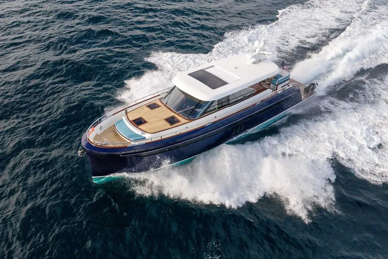 Slide: The Image of Luxurious 2021 Steeler 60S yacht cruising swiftly on open water. - 25