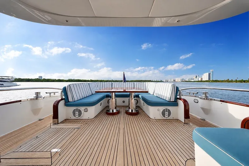 Slide: The Image of Luxurious 2021 Steeler 60S yacht deck with elegant seating and scenic waterfront view. - 55