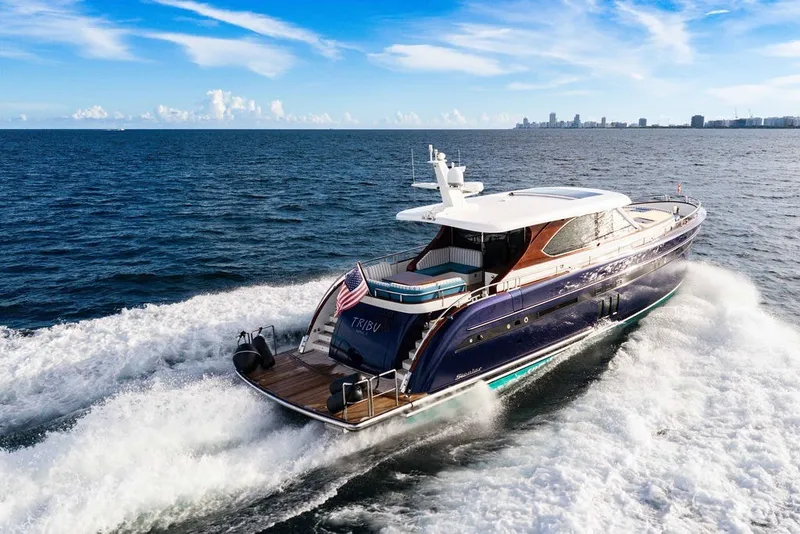 Slide: The Image of Luxurious 2021 Steeler 60S yacht cruising on open sea under clear blue sky. - 0