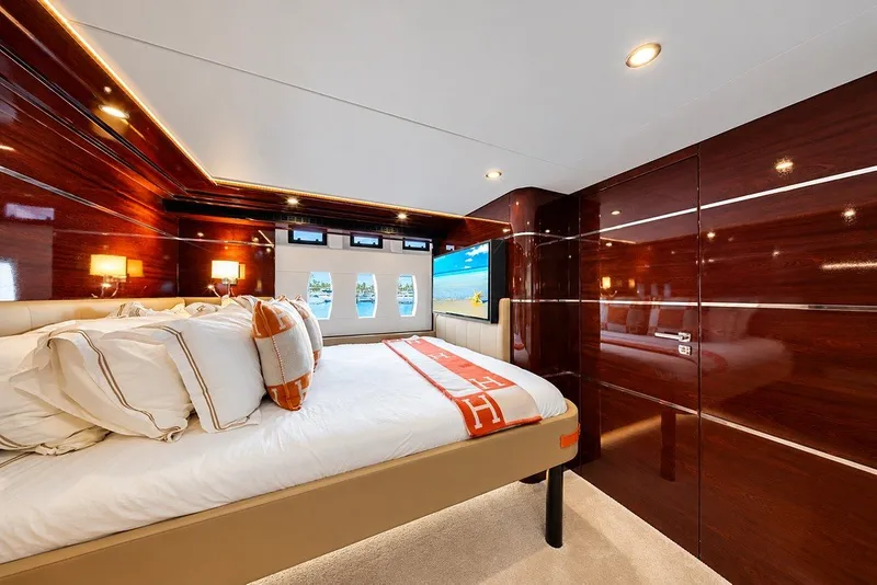 Slide: The Image of Luxurious bedroom interior of 2021 Steeler 60S yacht with elegant wood paneling and modern decor. - 108