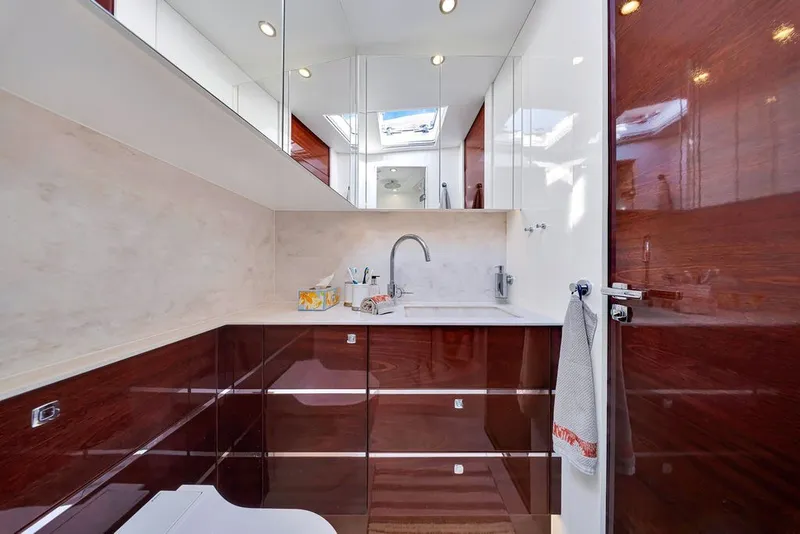 Slide: The Image of Luxurious bathroom interior of 2021 Steeler 60S yacht with sleek wood finishes. - 110