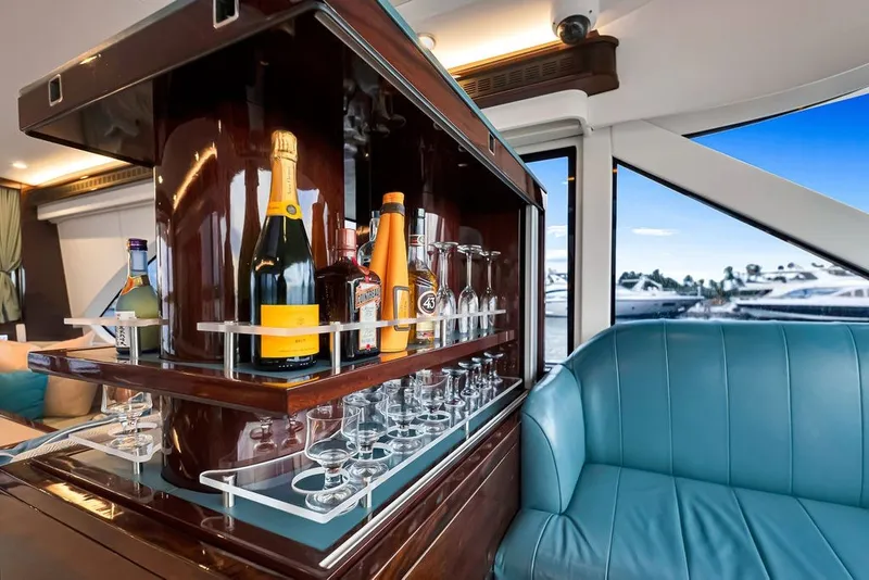 Slide: The Image of Luxurious bar setup on 2021 Steeler 60S yacht with elegant seating and scenic marina view. - 73