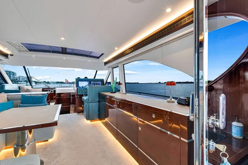 Slide: The Image of Luxurious interior of 2021 Steeler 60S yacht with elegant furnishings and panoramic windows. - 65