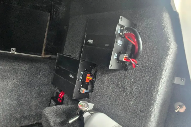 Slide: The Image of 2025 Malibu Wakesetter 23 LSV interior showing audio system components and wiring. - 16