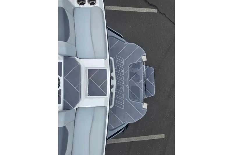 Slide: The Image of 2025 Malibu Wakesetter 23 LSV boat, top view, showcasing sleek design and seating. - 21
