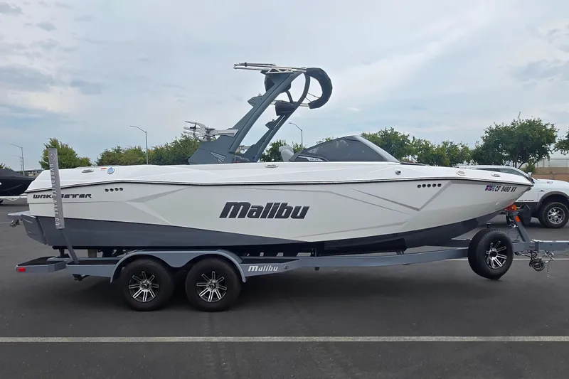 The Image of 2025 Malibu Wakesetter 23 LSV boat on trailer, parked outdoors. - 0