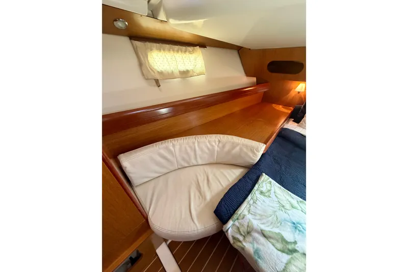 Slide: The Image of Cozy cabin interior of 2007 Jeanneau Sun Odyssey 42 DS sailboat with wooden accents. - 59