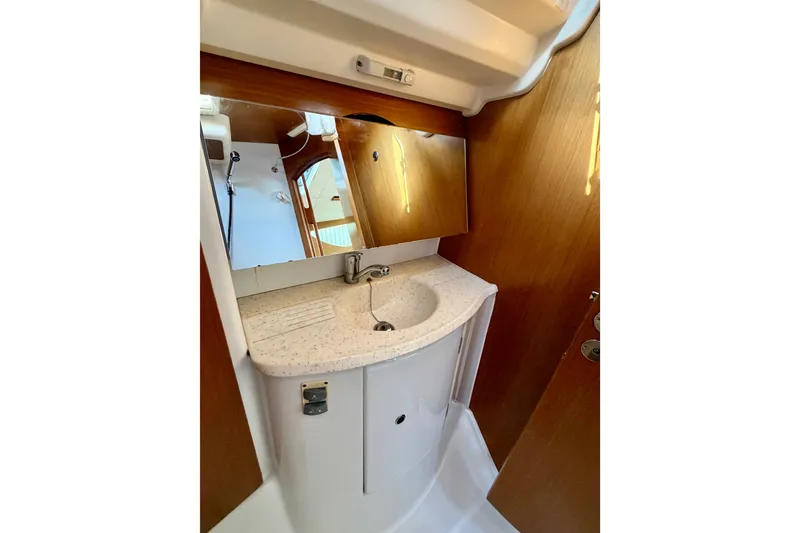 Slide: The Image of Compact bathroom in 2007 Jeanneau Sun Odyssey 42 DS yacht with sink and mirror. - 61