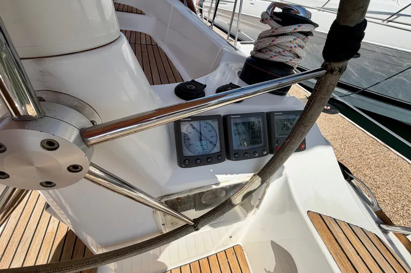 Slide: The Image of Cockpit of 2007 Jeanneau Sun Odyssey 42 DS with navigation instruments and winch. - 98