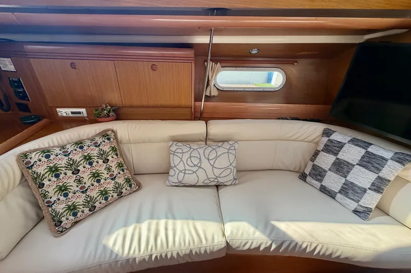 Slide: The Image of Interior of 2007 Jeanneau Sun Odyssey 42 DS with cozy seating and decorative pillows. - 45