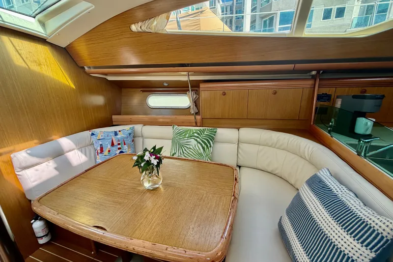 Slide: The Image of Luxurious interior of 2007 Jeanneau Sun Odyssey 42 DS yacht with cozy seating and decor. - 90