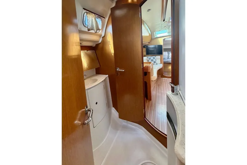 Slide: The Image of Interior of 2007 Jeanneau Sun Odyssey 42 DS yacht, featuring wooden cabinetry and modern design. - 63