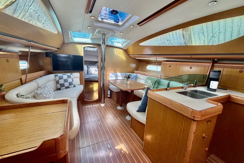 Slide: The Image of Interior of 2007 Jeanneau Sun Odyssey 42 DS yacht with elegant wood finish and seating area. - 41