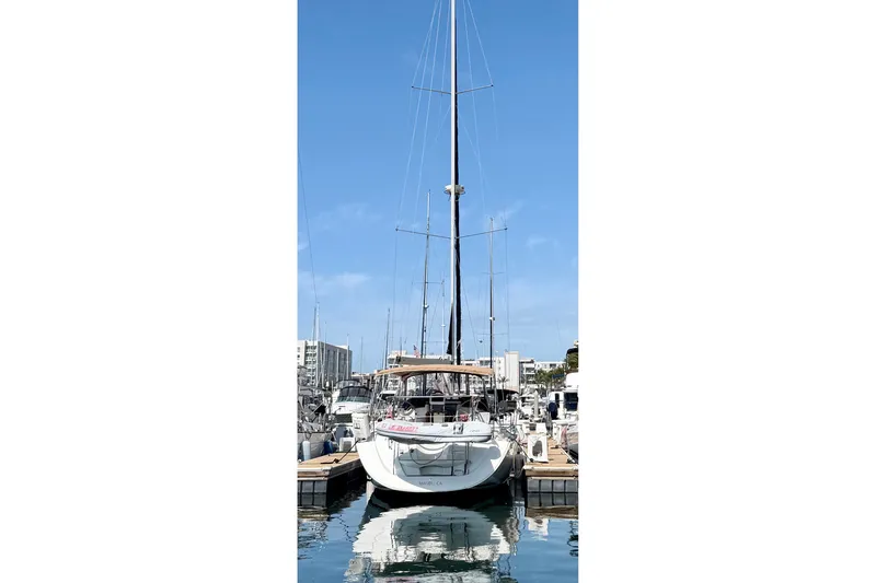 Slide: The Image of 2007 Jeanneau Sun Odyssey 42 DS sailboat docked in a marina under clear blue skies. - 22