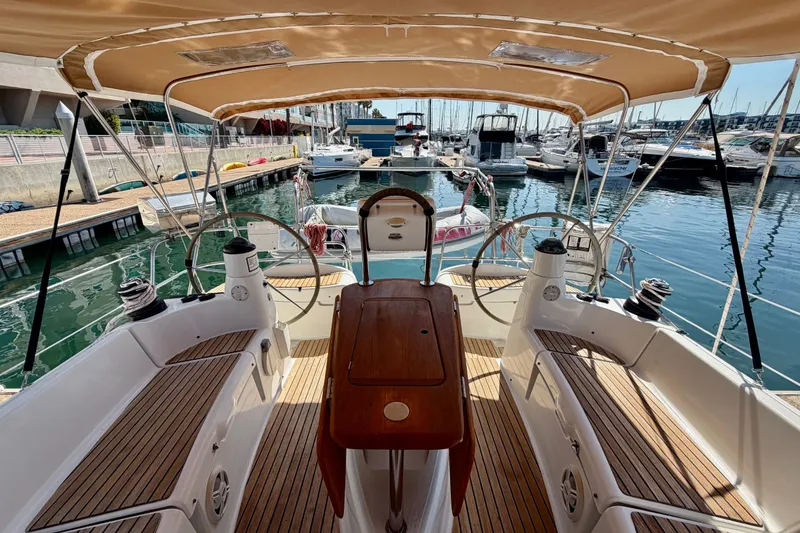 Slide: The Image of Cockpit view of 2007 Jeanneau Sun Odyssey 42 DS sailboat docked in marina. - 23