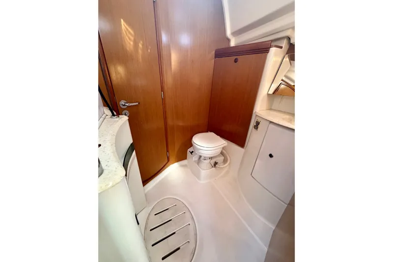 Slide: The Image of Bathroom interior of 2007 Jeanneau Sun Odyssey 42 DS yacht, featuring wooden door and compact design. - 60