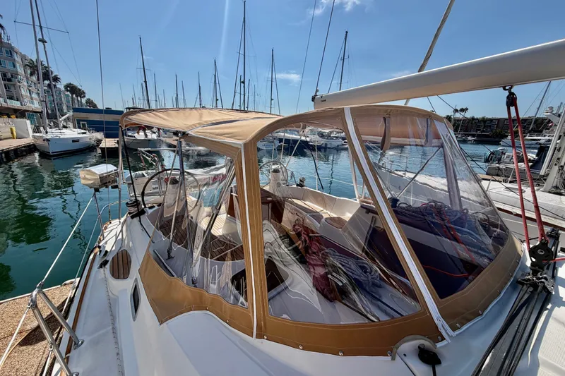 Slide: The Image of 2007 Jeanneau Sun Odyssey 42 DS sailboat docked in a marina under clear skies. - 8