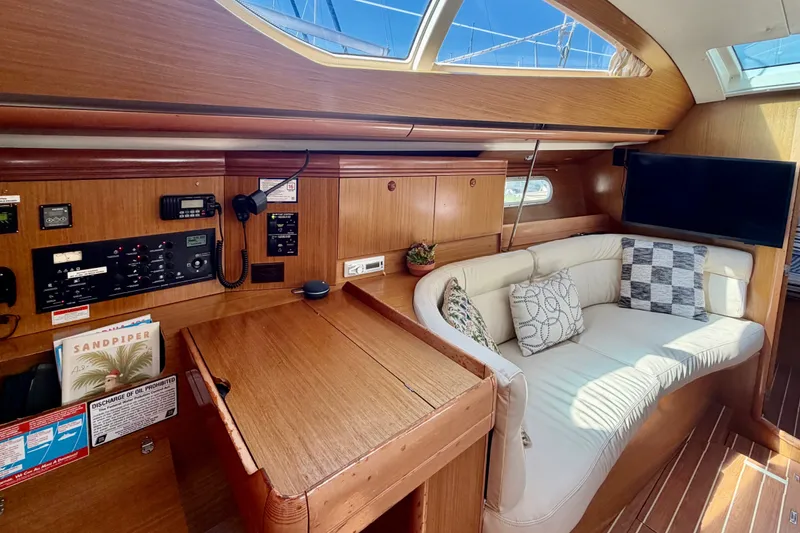 Slide: The Image of Interior of 2007 Jeanneau Sun Odyssey 42 DS yacht with cozy seating and navigation station. - 46