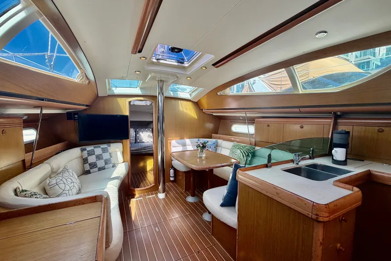 Slide: The Image of Luxurious interior of 2007 Jeanneau Sun Odyssey 42 DS sailboat with elegant wood finish. - 39