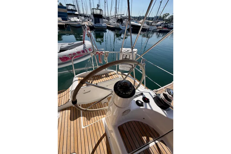 Slide: The Image of Steering wheel of 2007 Jeanneau Sun Odyssey 42 DS sailboat in marina. - 35