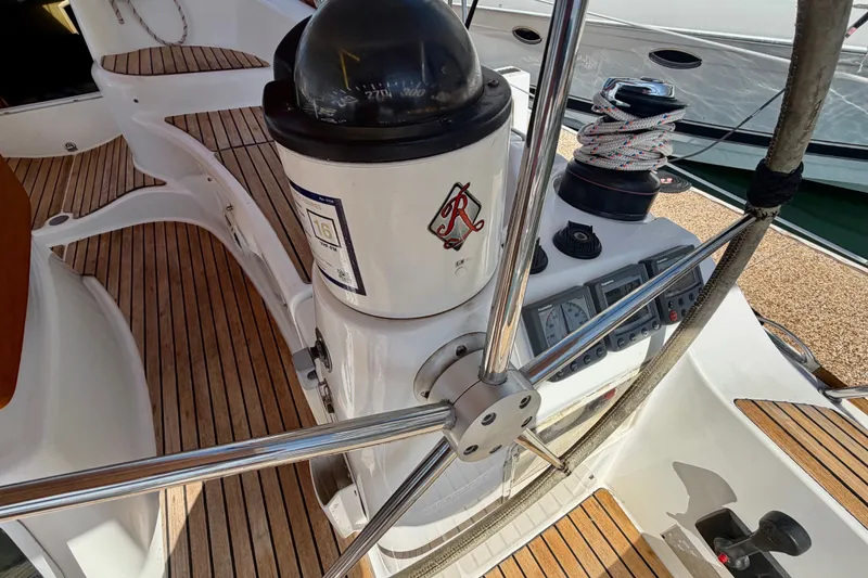 Slide: The Image of Cockpit of 2007 Jeanneau Sun Odyssey 42 DS with compass and navigation instruments. - 97