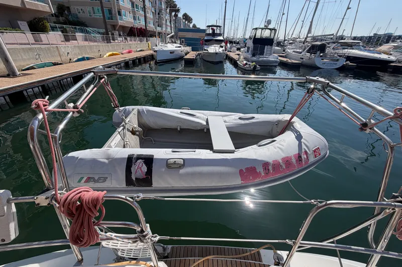 Slide: The Image of Inflatable dinghy on Jeanneau Sun Odyssey 42 DS, 2007, docked at marina with sailboats. - 37