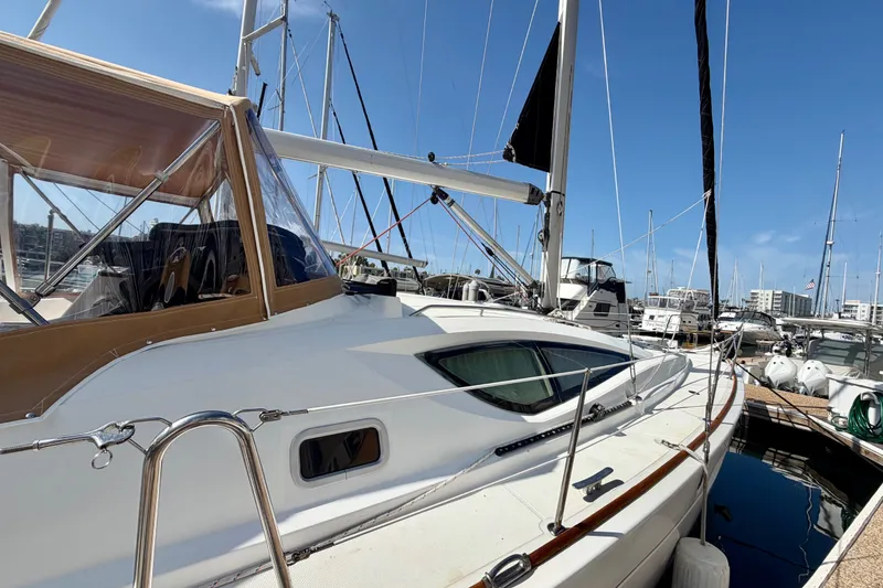 Slide: The Image of 2007 Jeanneau Sun Odyssey 42 DS sailboat docked at marina under clear blue sky. - 6