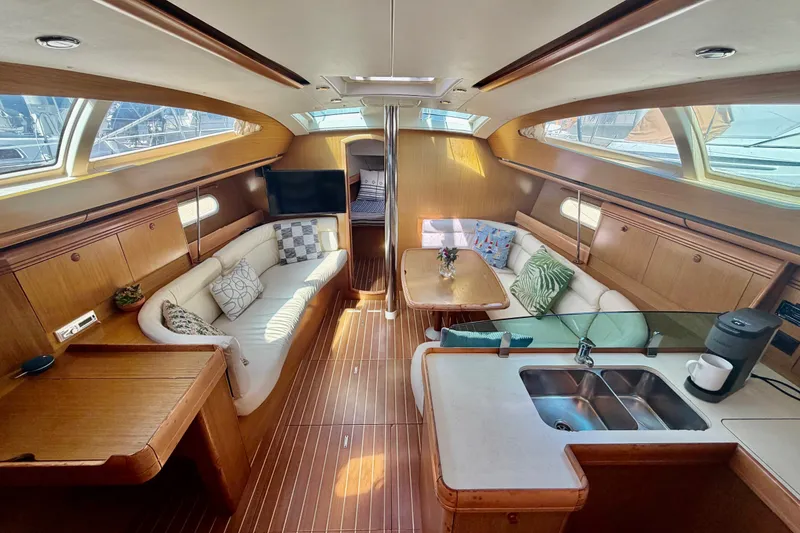 Slide: The Image of Luxurious interior of 2007 Jeanneau Sun Odyssey 42 DS yacht with elegant wood finish. - 93