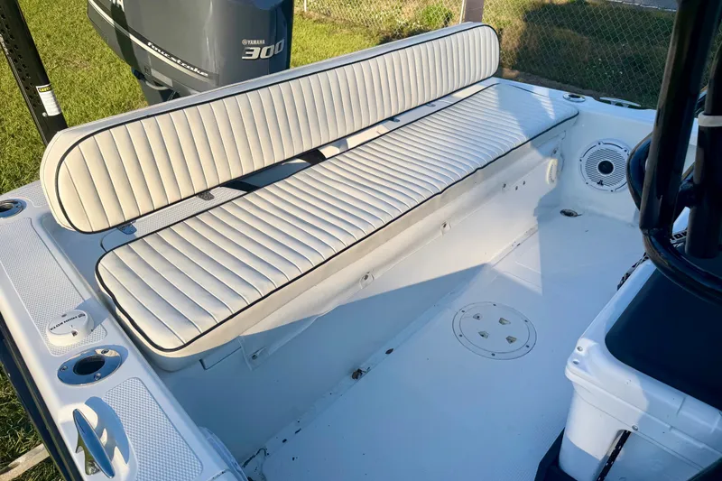 Slide: The Image of White seating area on a 2012 BlackJack 224 boat with Yamaha 300 engine. - 7