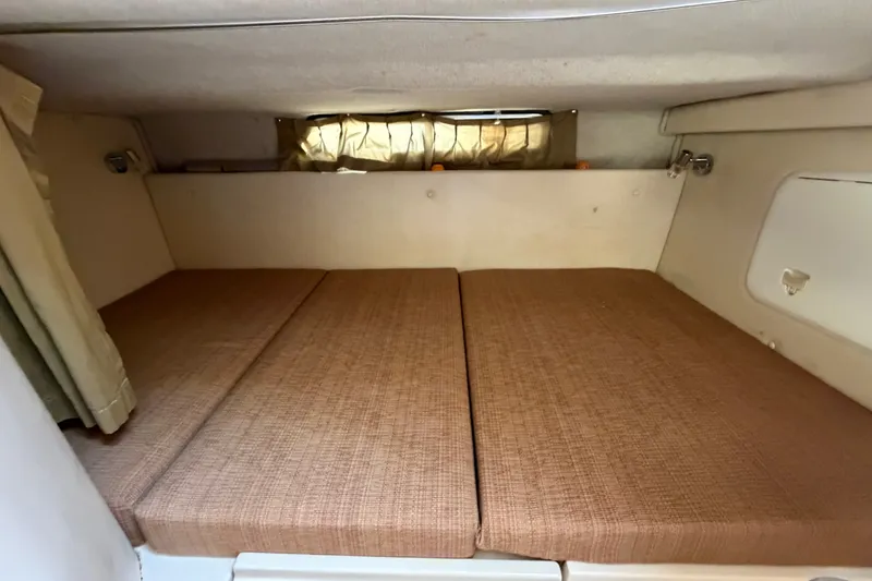 Slide: The Image of Interior cabin of 2005 Wellcraft 290 Coastal boat with brown cushions. - 45