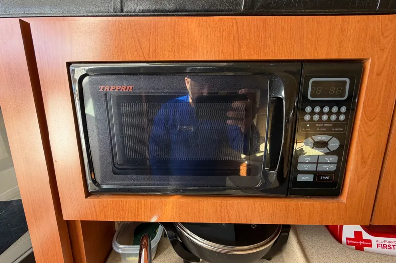 Slide: The Image of Tappan microwave in a 2005 Wellcraft 290 Coastal boat kitchen setup. - 42