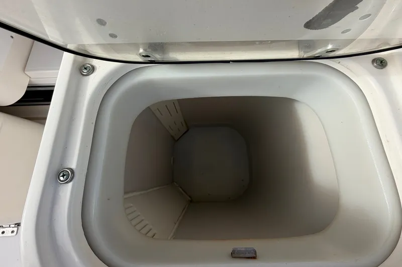 Slide: The Image of Open storage compartment on a 2005 Wellcraft 290 Coastal boat. - 21