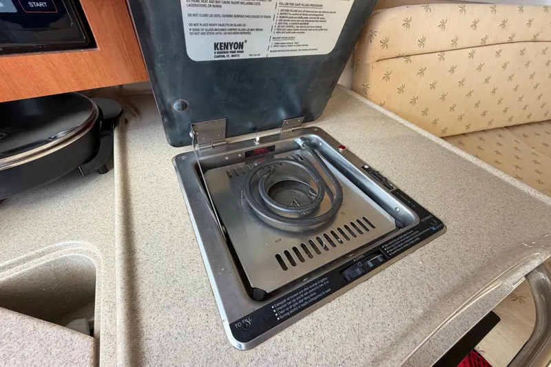 Slide: The Image of Kenyon stove in 2005 Wellcraft 290 Coastal boat kitchen area. - 41