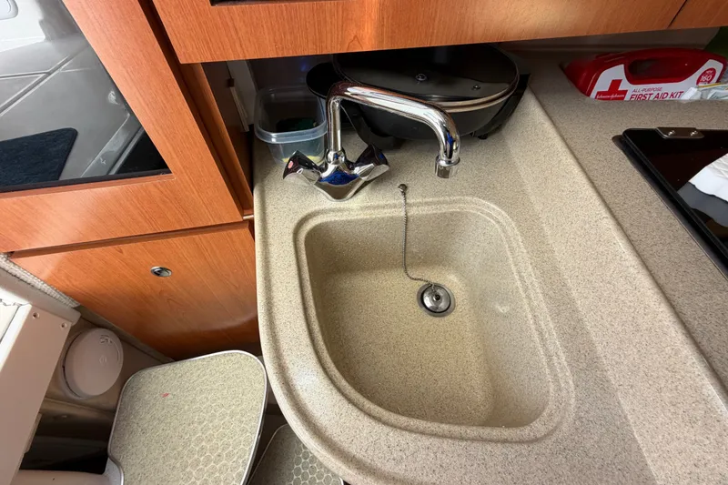 Slide: The Image of 2005 Wellcraft 290 Coastal boat interior with sink and countertop. - 43