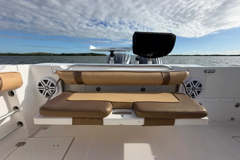 Slide: The Image of 2005 Wellcraft 290 Coastal boat interior with cushioned seating and scenic water view. - 14