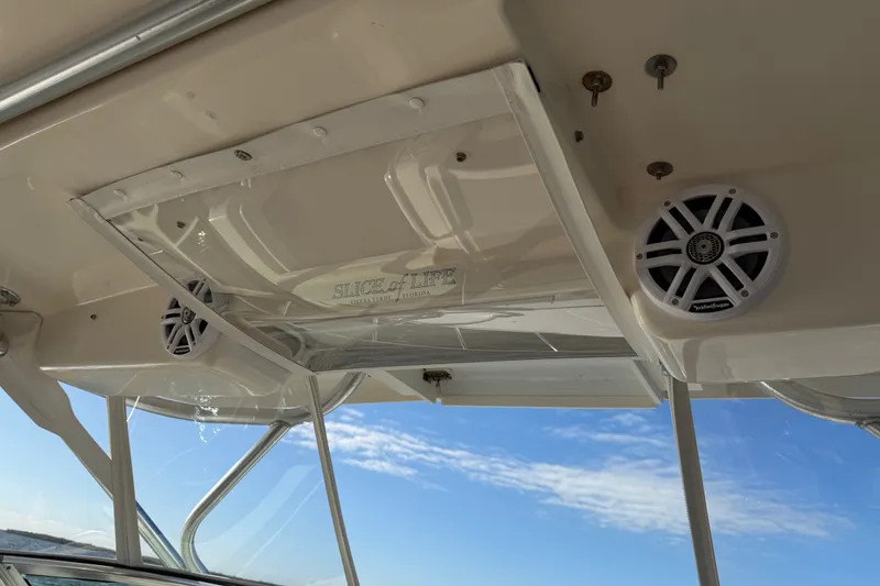 Slide: The Image of Interior view of 2005 Wellcraft 290 Coastal boat with speakers and clear sky. - 51