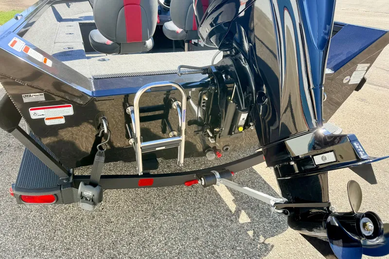 Slide: The Image of 2023 Ranger VS1665T boat rear view with motor and ladder. - 20