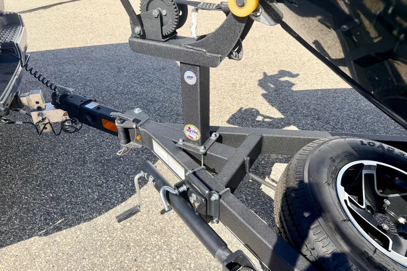 Slide: The Image of Trailer hitch and tire of 2023 Ranger VS1665T on asphalt surface. - 68
